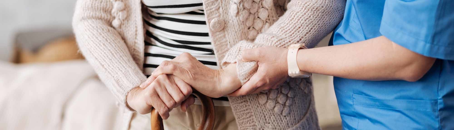 homecare for veterans caregiver holding a woman hand