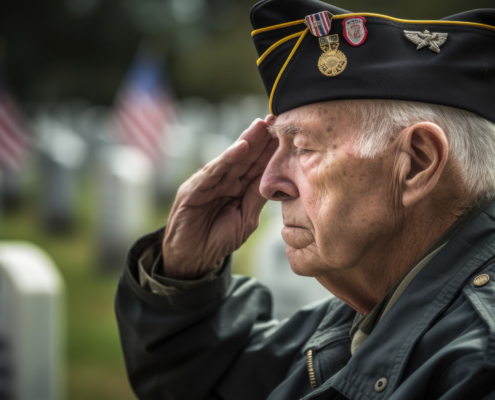 American Senior War Veteran saluting his fallen comrades
