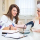Nurse at home with elderly person